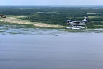 plane over a body of water